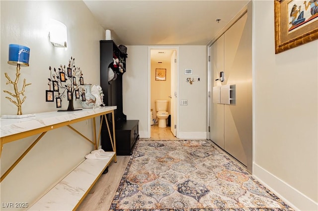 hallway featuring light hardwood / wood-style flooring