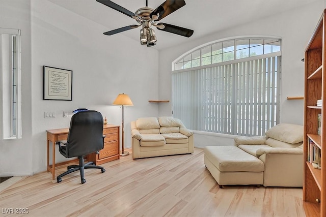 office area with light hardwood / wood-style floors and ceiling fan