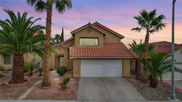3320 Haven Beach Way, Las Vegas, NV 89117 - view of front of house featuring concrete driveway, stucco siding, and a tiled roof