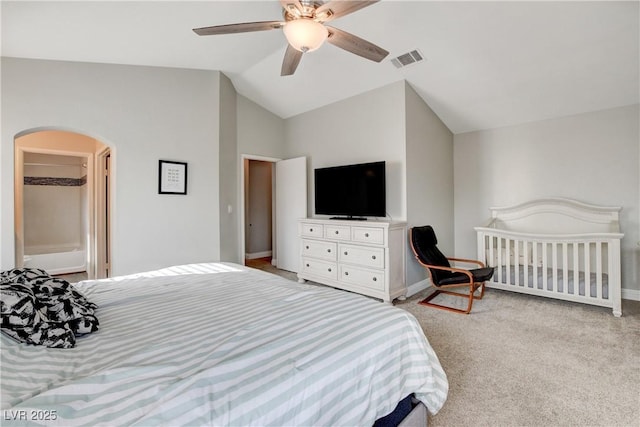 3320 Haven Beach Way, Las Vegas, NV 89117 - bedroom featuring lofted ceiling, light carpet, arched walkways, baseboards, and a ceiling fan