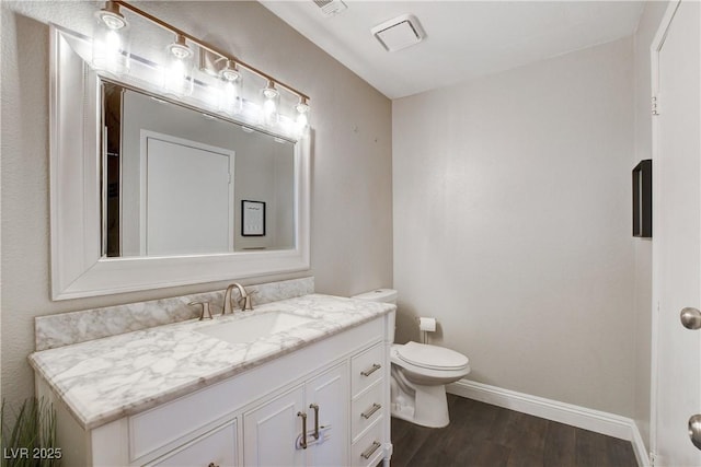 3320 Haven Beach Way, Las Vegas, NV 89117 - bathroom featuring vanity, wood finished floors, baseboards, and toilet