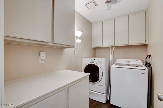 3320 Haven Beach Way, Las Vegas, NV 89117 - laundry area with washing machine and clothes dryer, cabinet space, and dark wood finished floors