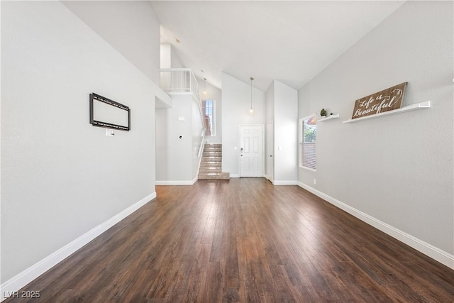 3320 Haven Beach Way, Las Vegas, NV 89117 - foyer with high vaulted ceiling, dark wood-style floors, and stairway