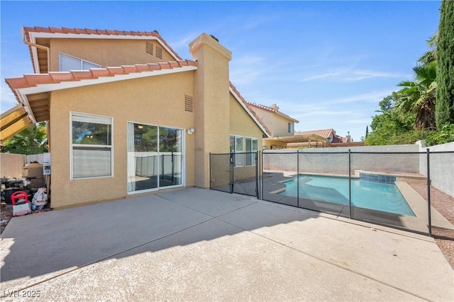 3320 Haven Beach Way, Las Vegas, NV 89117 - back of house with stucco siding, a patio area, a fenced backyard, and a tiled roof