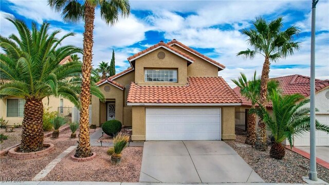 3320 Haven Beach Way, Las Vegas, NV 89117 - mediterranean / spanish-style house with stucco siding, a tiled roof, concrete driveway, and an attached garage