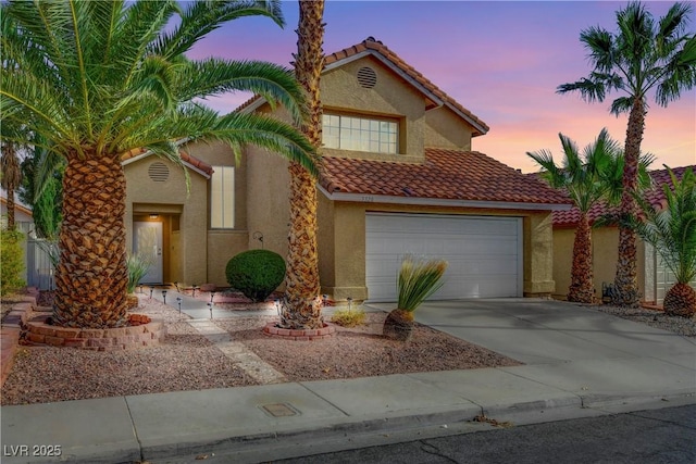 3320 Haven Beach Way, Las Vegas, NV 89117 - view of front of home with stucco siding, a tile roof, driveway, and an attached garage