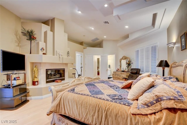 bedroom featuring a towering ceiling