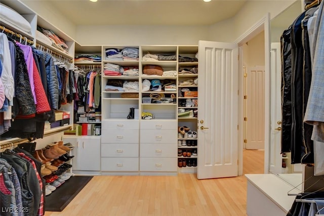 spacious closet featuring light hardwood / wood-style floors