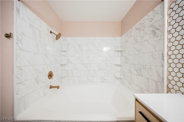 bathroom with vanity and tiled shower / bath combo