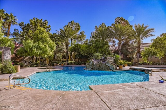 view of swimming pool with a patio