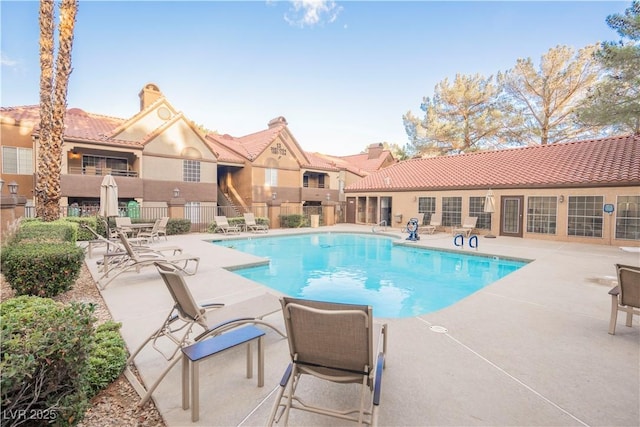 view of swimming pool featuring a patio area