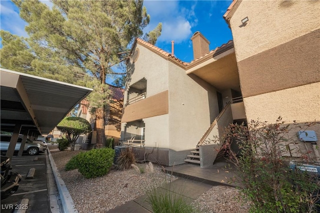 exterior space featuring a carport