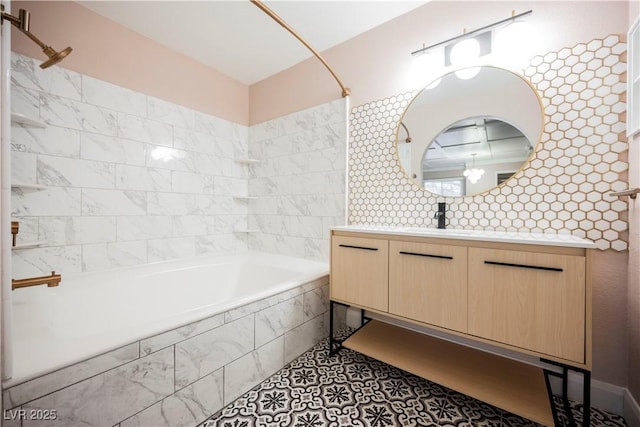 bathroom featuring vanity, tile patterned floors, and tiled shower / bath