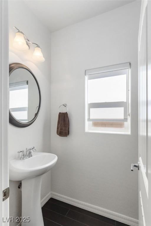 bathroom featuring a wealth of natural light and sink