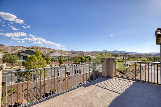 balcony featuring a mountain view