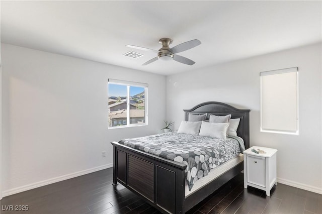 bedroom featuring ceiling fan and dark wood-type flooring