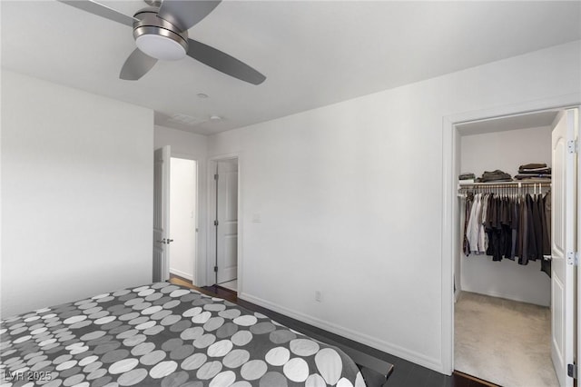 bedroom with ceiling fan and a closet