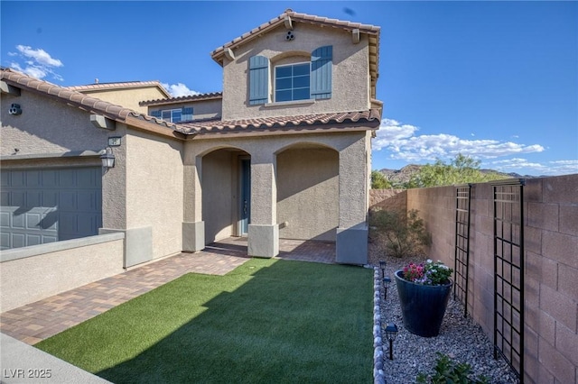 exterior space featuring a yard and a garage