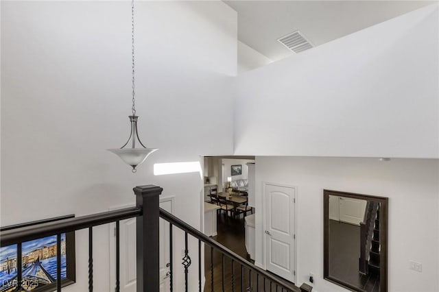 hall featuring lofted ceiling