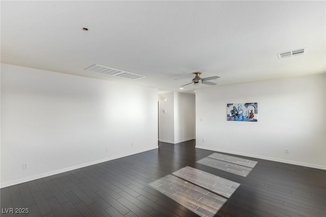 empty room featuring ceiling fan and dark hardwood / wood-style floors