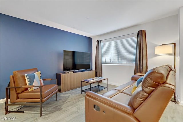 living room with light hardwood / wood-style flooring