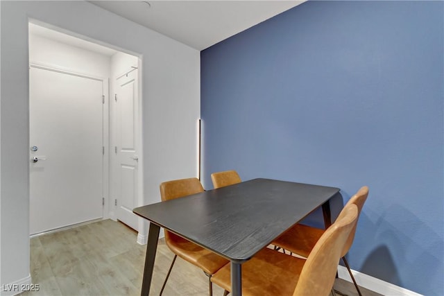 dining room with light wood-type flooring