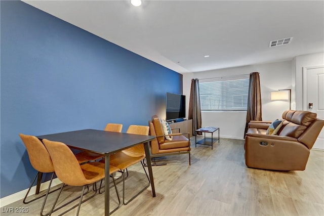 dining area with light wood-type flooring