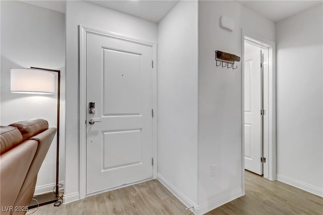 entryway with light hardwood / wood-style floors