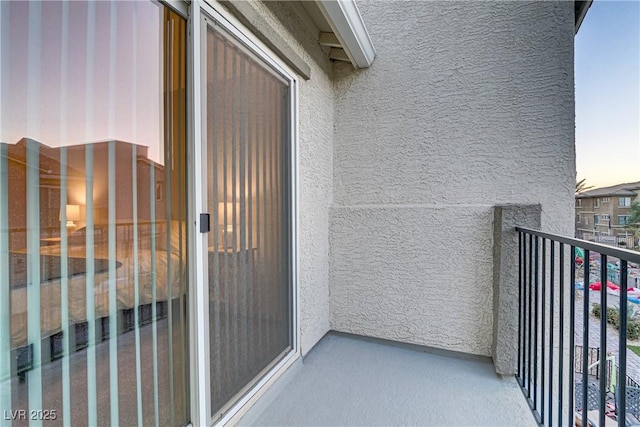 view of balcony at dusk