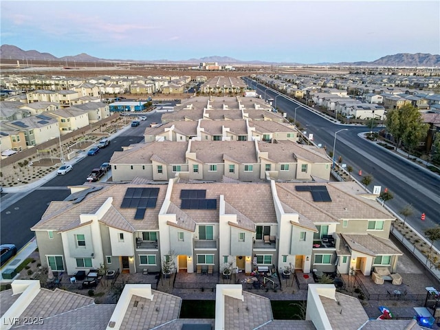 birds eye view of property featuring a mountain view