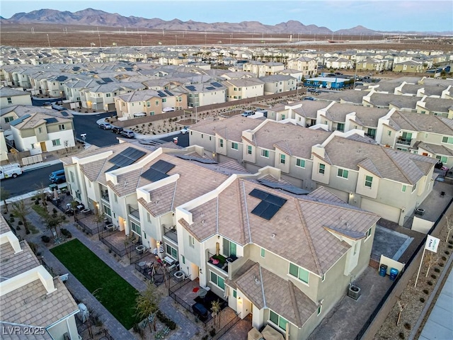 birds eye view of property with a mountain view