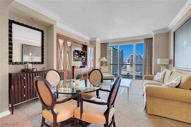 dining space with ornamental molding