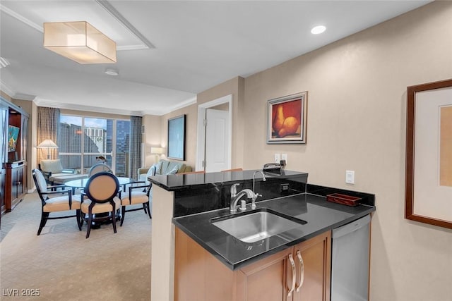 kitchen with dishwasher, kitchen peninsula, ornamental molding, and sink