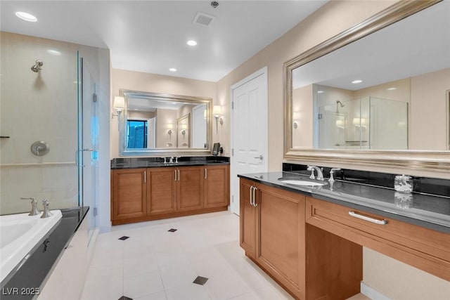 bathroom featuring tile patterned flooring, vanity, and separate shower and tub