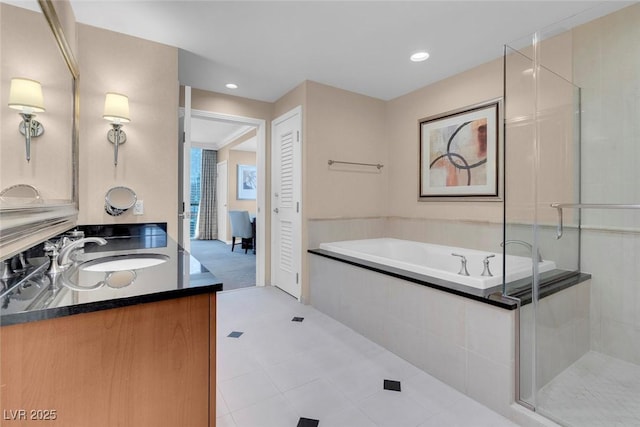 bathroom with tile patterned floors, vanity, and plus walk in shower