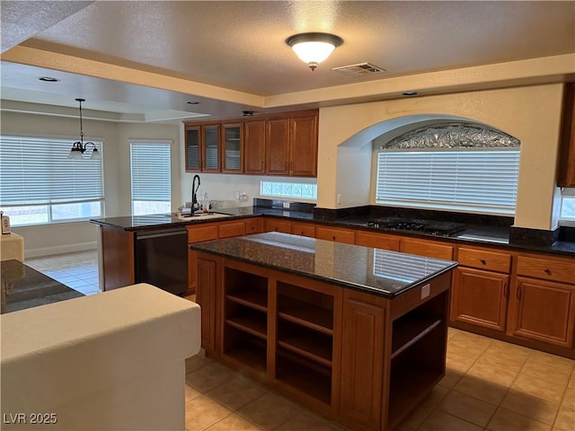 kitchen with sink, black appliances, decorative light fixtures, a center island, and light tile patterned flooring