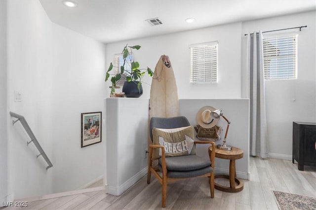 sitting room featuring light hardwood / wood-style floors