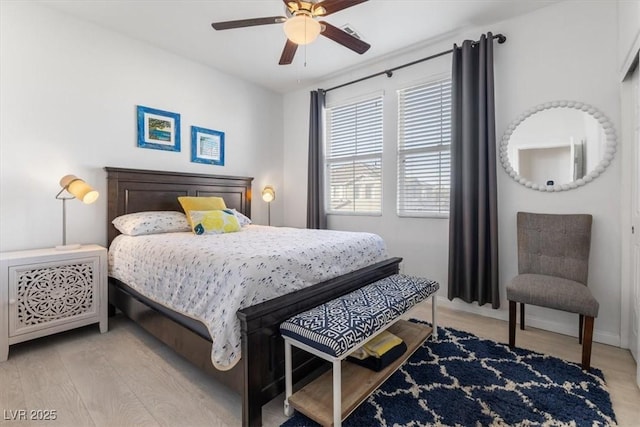 bedroom with ceiling fan and light hardwood / wood-style floors