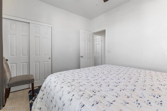 bedroom featuring a closet and light hardwood / wood-style flooring