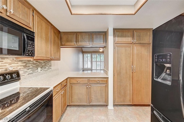 kitchen with backsplash and black appliances