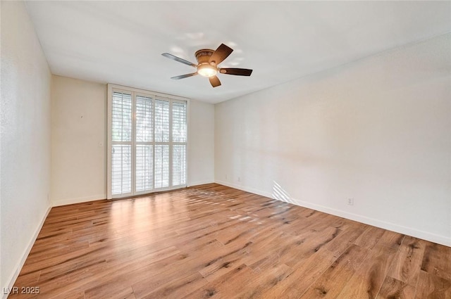 unfurnished room with ceiling fan and light wood-type flooring