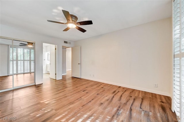 interior space with light hardwood / wood-style floors and ceiling fan