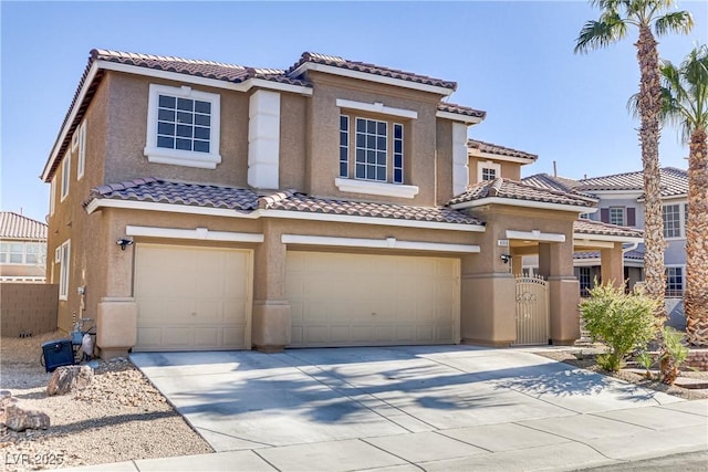 mediterranean / spanish-style home featuring a garage