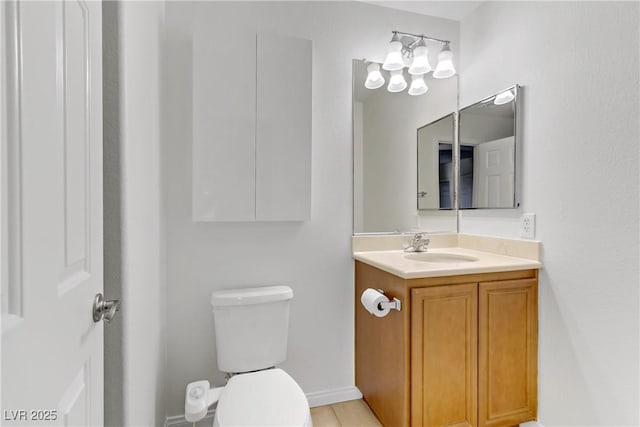 bathroom with toilet and vanity