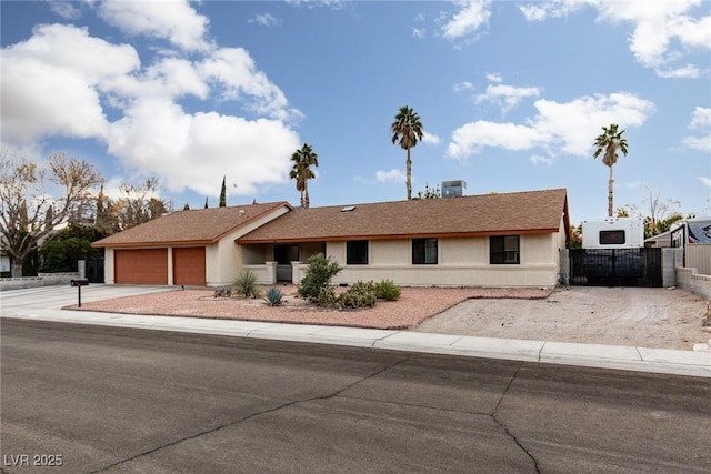 ranch-style home featuring a garage