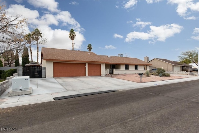 ranch-style house featuring a garage