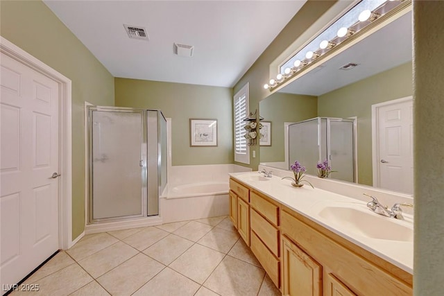 bathroom with independent shower and bath, vanity, and tile patterned floors