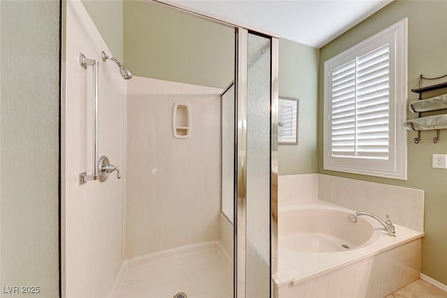 bathroom featuring independent shower and bath and tile patterned flooring