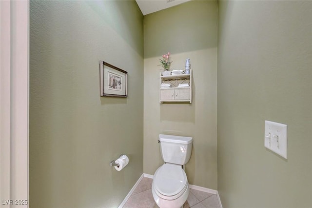 bathroom featuring tile patterned floors and toilet