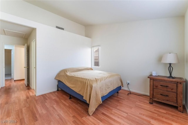 bedroom with light wood-type flooring